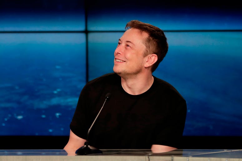 AP18351857016556 In this Feb. 6, 2018, file photo, Elon Musk, founder, CEO, and lead designer of SpaceX, speaks at a news conference from the Kennedy Space Center in Cape Canaveral, Fla. Musk is set to unveil an underground transportation tunnel that could move people fas