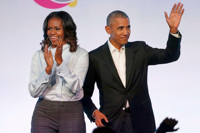 AP19120593584011 In this Oct. 31, 2017, file photo, former President Barack Obama, right, and former first lady Michelle Obama appear at the Obama Foundation Summit in Chicago. (Photo credit: AP Photo/Charles Rex Arbogast, File)