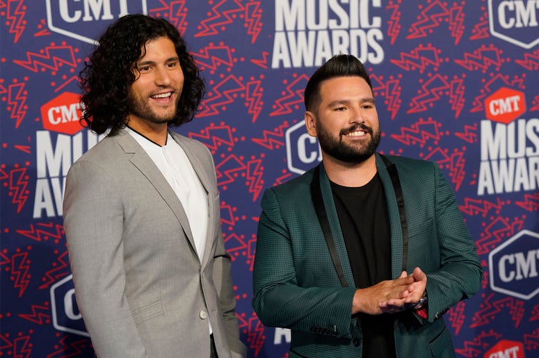 AP19157002413280 Dan Smyers, left, and Shay Mooney, of Dan + Shay, arrive at the CMT Music Awards on Wednesday, June 5, 2019, at the Bridgestone Arena in Nashville, Tenn. (AP Photo/Sanford Myers)