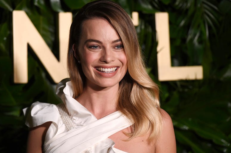 AP19256182318827 Actress Margot Robbie poses for photographers at the launch of the Gabrielle Chanel Essence fragrance at the Chateau Marmont, Thursday, Sept. 12, 2019, in Los Angeles. (Photo by Chris Pizzello/Invision/AP)