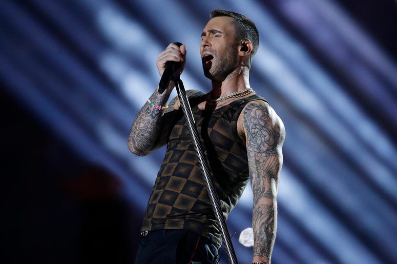 AP19339549186174 In this Feb. 3, 2019 file photo, Adam Levine of Maroon 5 performs during halftime of the NFL Super Bowl 53 football game between the Los Angeles Rams and the New England Patriots in Atlanta. (AP Photo/Mark Humphrey, File)