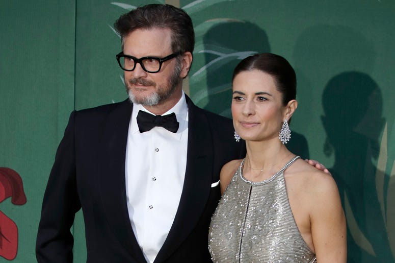 AP19349382384000 In this file photo dated Sunday, Sept. 22, 2019, British actor Colin Firth and his wife Livia, pose for photographers upon arrival at the Green Carpet Fashion Awards in Milan, Italy. (AP Photo/Luca Bruno, FILE)