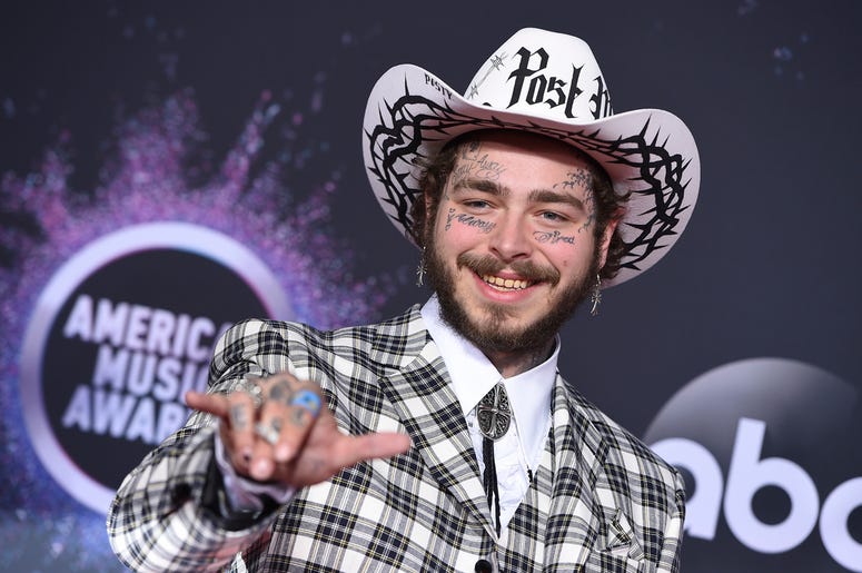 AP19351469362574 In this Nov. 24, 2019, file photo Post Malone arrives at the American Music Awards at the Microsoft Theater in Los Angeles. (Photo by Jordan Strauss/Invision/AP, File)