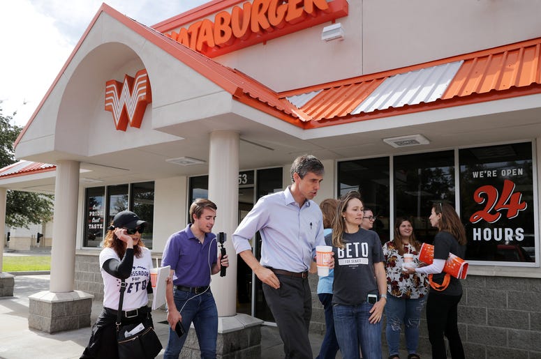 (Chip Somodevilla/Getty Images) Rep. Beto O'Rourke (D-TX) (C), his Logistics and Events Manager Cynthia Cano (L), campaign Communications Director Chris Evans and O'Rourke's sister Charlotte O'Rourke head back out to canvass after lunch at a Whataburger November 3.