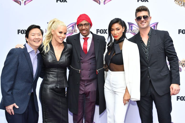 (Amy Sussman/ Getty Images) The Masked Singer Panel including Ken Jeong, Jenny McCarthy, Nick Cannon, Nicole Scherzinger, and Robin Thicke
