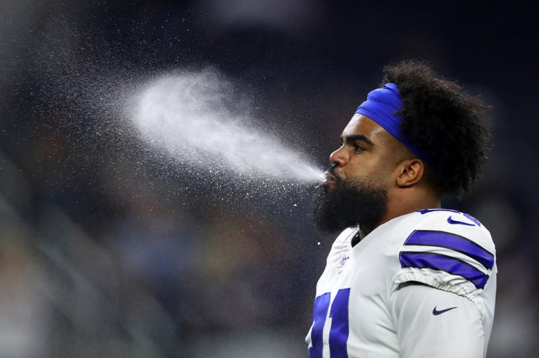 (Tom Pennington/Getty Images) Ezekiel Elliott #21 of the Dallas Cowboys blows water from his mouth before the game against the Philadelphia Eagles at AT&T Stadium on October 20, 2019 in Arlington, Texas.