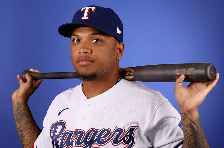 (Photo by Christian Petersen/Getty Images) Willie Calhoun #5 of the Texas Rangers poses for a portrait during MLB media day on February 19, 2020 in Surprise, Arizona.
