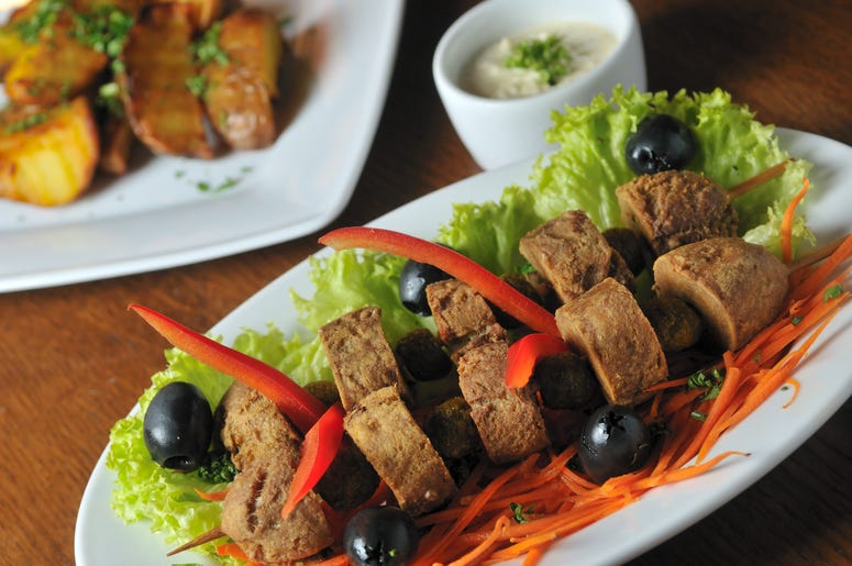 (hrabar/ iStock/ Getty Images Plus) deep fried beef testicles with olives