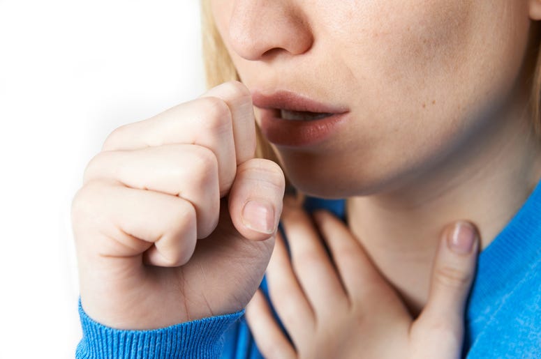 (Highwaystarz-Photography/ iStock/ Getty Images Plus) Close-up of woman coughing