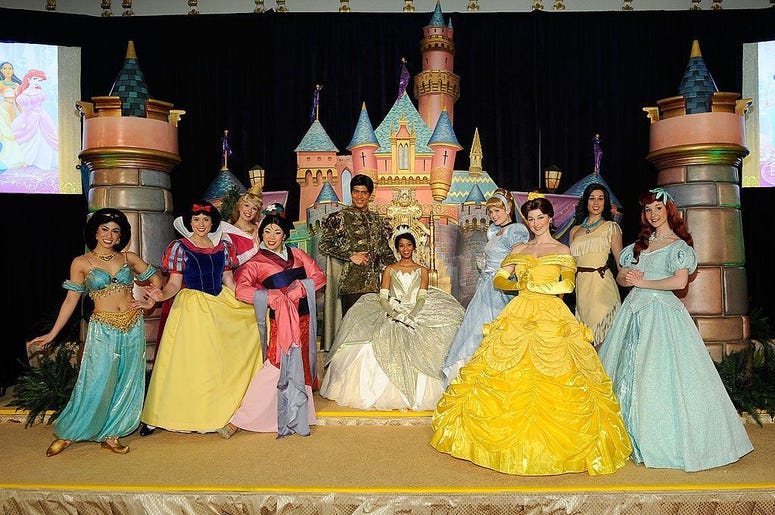 (Jemal Countess/Getty Images) Disney Princess Royal Court at The New York Palace Hotel on March 14, 2010 in New York City. She is seen with people dressed as characters (L-R) Princess Jasmin, Snow White, Mulan, Aurora, Prince Naven, Cinderella, Princess Bell, Pocahantas