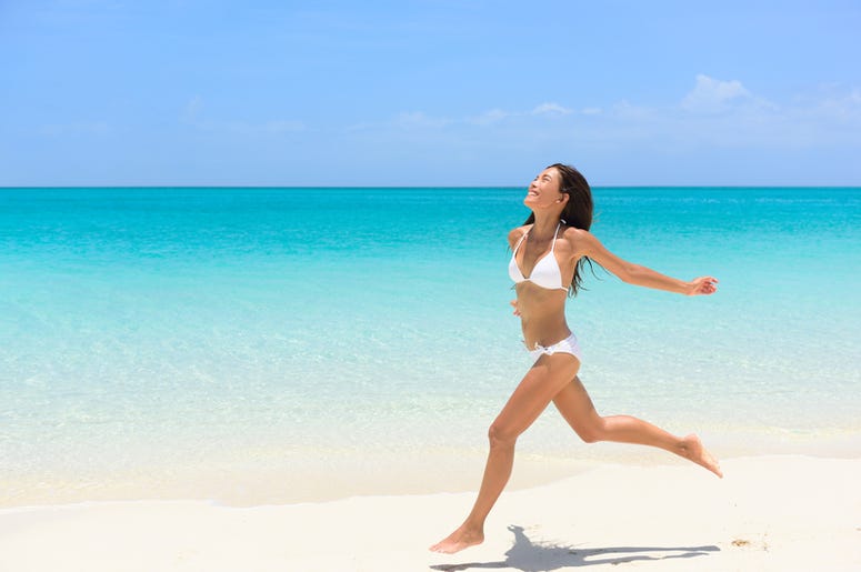Woman Runs On The Beach beach_running