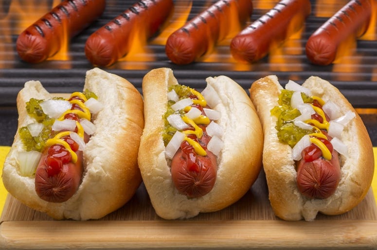 Hot Dogs Grilled in Buns Barbecue Grill Background Hot Dogs Grilled in Buns Barbecue Grill Background