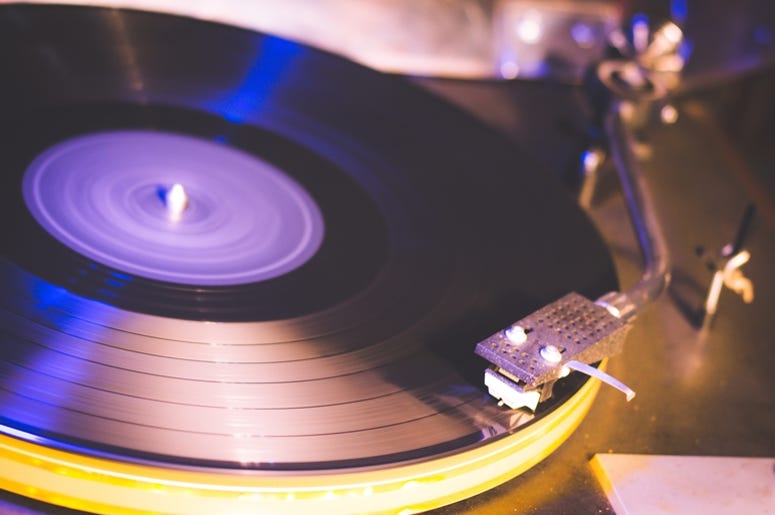 Close up at vintage gramophone. playing old song,Vintage record player with vinyl disc. Object, music. Close up at vintage gramophone. playing old song,Vintage record player with vinyl disc. Object, music.