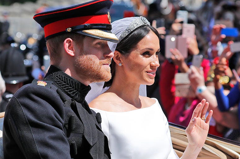 Britain's Prince Harry and his bride Meghan Markle Britain's Prince Harry and his bride Meghan Markle