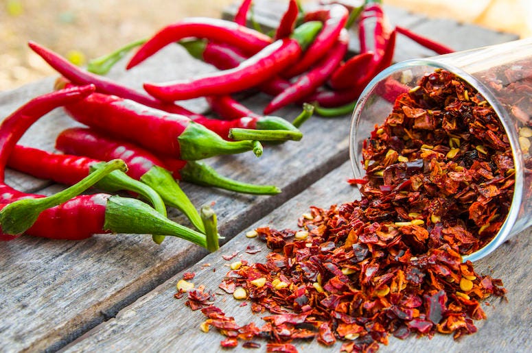 Red Pepper Flakes, Chilis, Wooden Table Red Pepper Flakes, Chilis, Wooden Table