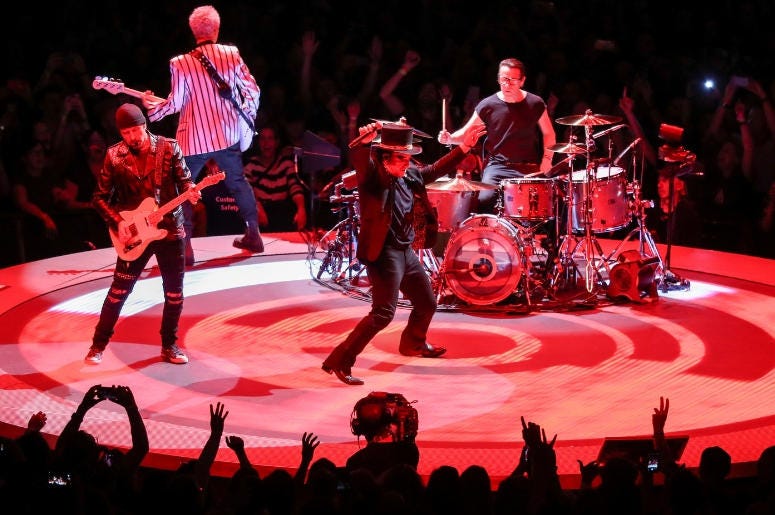 U2 perform on stage at the U2 eXPERIENCE + iNNOCENCE Tour. The O2 Arena, London U2 perform on stage at the U2 eXPERIENCE + iNNOCENCE Tour. The O2 Arena, London
