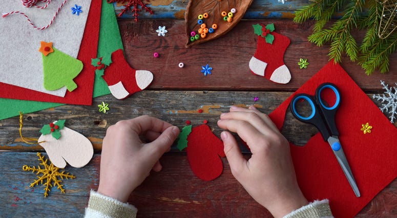 Child making Christmas craft