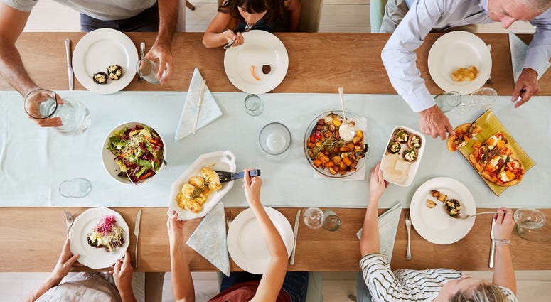 People sharing a meal around a dinner table