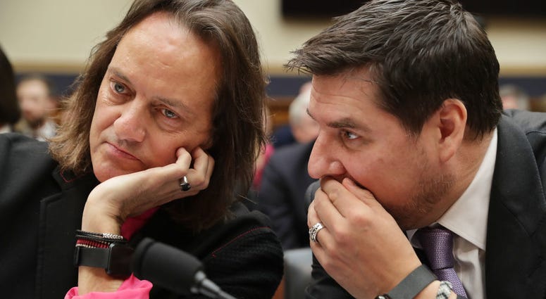 WASHINGTON, DC - MARCH 12: T-Mobile CEO John Legere (L) and Executive Director of Sprint Marcelo Claure talk before testifying to the House Judiciary Committee's Antitrust, Commercial and Administrative Law Subcommittee in the Rayburn House Office Buildin WASHINGTON, DC - MARCH 12: T-Mobile CEO John Legere (L) and Executive Director of Sprint Marcelo Claure talk before testifying to the House Judiciary Committee's Antitrust, Commercial and Administrative Law Subcommittee in the Rayburn House Office Buildin