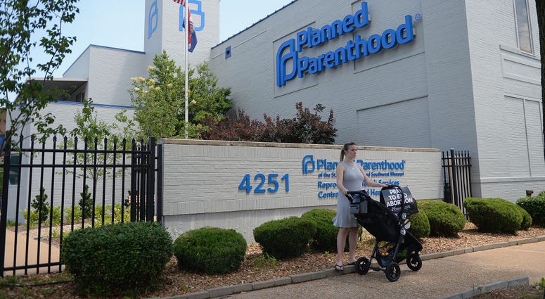 ST LOUIS, MO - JUNE 04: A women stands with her child in a stroller during a pro-life rally outside the Planned Parenthood Reproductive Health Center on June 4, 2019 in St Louis, Missouri. The fate of Missouri's lone abortion clinic could be decided today ST LOUIS, MO - JUNE 04: A women stands with her child in a stroller during a pro-life rally outside the Planned Parenthood Reproductive Health Center on June 4, 2019 in St Louis, Missouri. The fate of Missouri's lone abortion clinic could be decided today