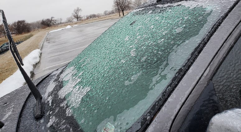Photograph of a car in Platte County, Missouri that is covered in ice.
