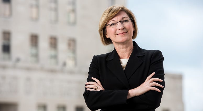 Jackson County Prosecutor Jean Peters Baker official portrait, standing in front of courthouse