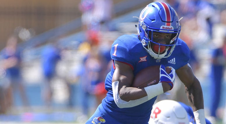 Sep 15, 2018; Lawrence, KS, USA; Kansas Jayhawks running back Pooka Williams Jr. (1) runs the ball during the first half against the Rutgers Scarlet Knights at Memorial Stadium. Mandatory Credit: Denny Medley-USA TODAY Sports