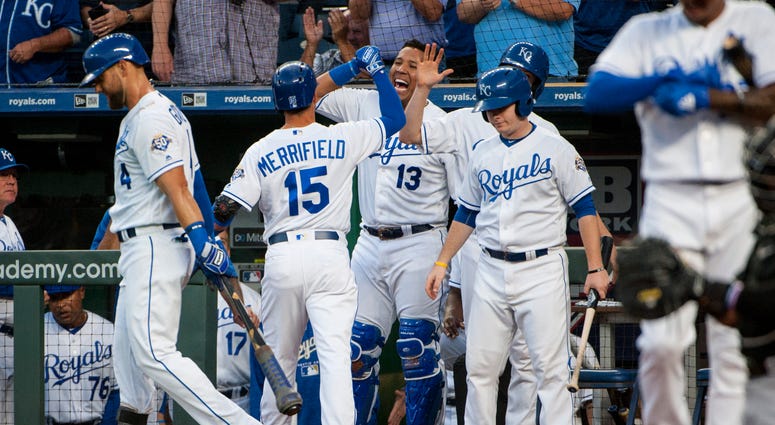 Sep 10, 2018; Kansas City, MO, USA; Kansas City Royals catcher Salvador Perez (13) celebrates with Kansas City Royals second baseman Whit Merrifield (15) after hitting a home run against the Chicago White Sox in the first inning at Kauffman Stadium.
