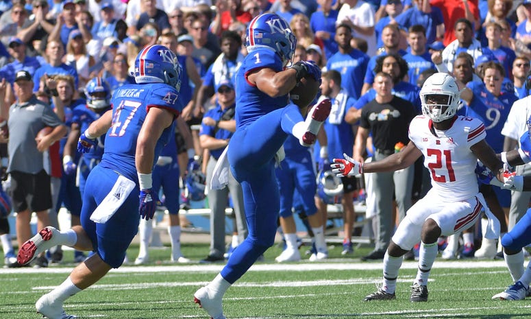 Sep 15, 2018; Lawrence, KS, USA; Kansas Jayhawks safety Bryce Torneden (1) intercepts a pass during the first half against the Rutgers Scarlet Knights at Memorial Stadium. Mandatory Credit: Denny Medley-USA TODAY Sports