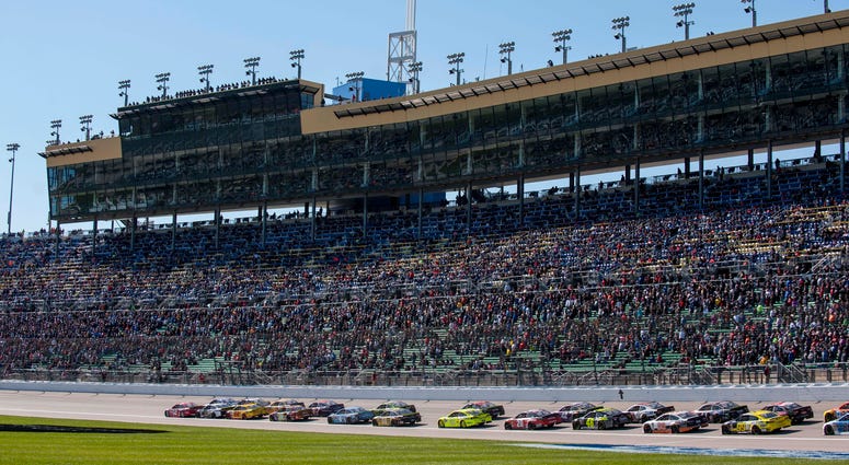 Oct 21, 2018; Kansas City, KS, USA; NASCAR Cup Series driver Ryan Blaney (12) leads the field during the Hollywood Casino 400 at Kansas Speedway. Mandatory Credit: Amy Kontras-USA TODAY Sports