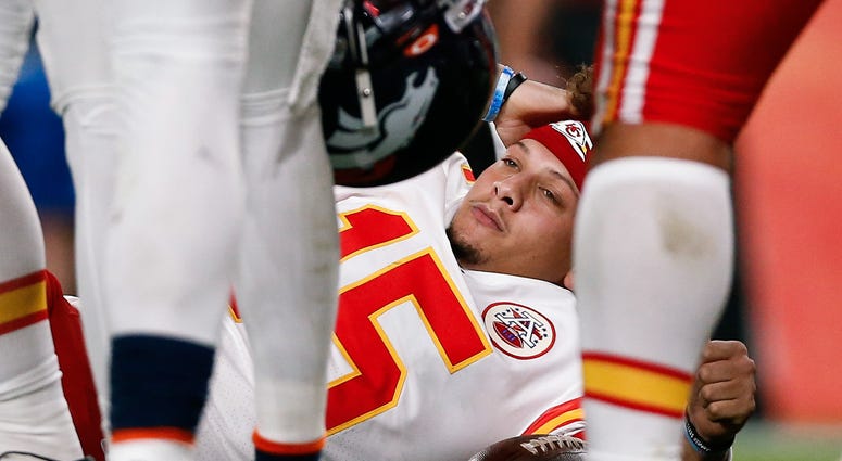 Oct 17, 2019 Kansas City Chiefs quarterback Patrick Mahomes (15) lies on the ground after a play in the second quarter against the Denver Broncos at Empower Field at Mile High.