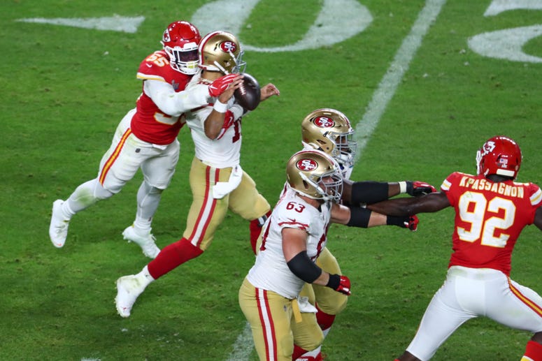 Feb 2, 2020; Miami Gardens, Florida, USA; Kansas City Chiefs defensive end Frank Clark (55) knocks the ball loose from San Francisco 49ers quarterback Jimmy Garoppolo (10) in Super Bowl LIV at Hard Rock Stadium. Mandatory Credit: Kim Klement-USA TODAY Spo Feb 2, 2020; Miami Gardens, Florida, USA; Kansas City Chiefs defensive end Frank Clark (55) knocks the ball loose from San Francisco 49ers quarterback Jimmy Garoppolo (10) in Super Bowl LIV at Hard Rock Stadium. Mandatory Credit: Kim Klement-USA TODAY Spo