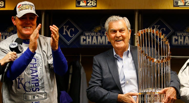 Nov 1, 2015; New York City, NY, USA; Kansas City Royals catcher Salvador Perez (right) and owner David Glass celebrate with the Commissioners Trophy after defeating the New York Mets in game five of the World Series at Citi Field. The Royals won the World Nov 1, 2015; New York City, NY, USA; Kansas City Royals catcher Salvador Perez (right) and owner David Glass celebrate with the Commissioners Trophy after defeating the New York Mets in game five of the World Series at Citi Field. The Royals won the World