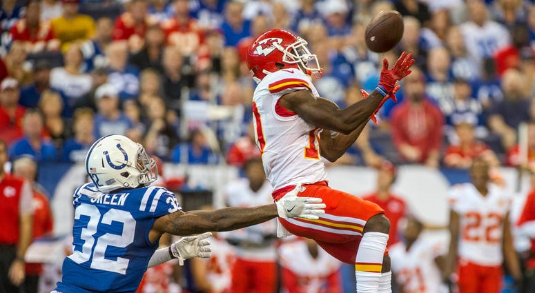 Oct 30, 2016; Indianapolis, IN, USA; Kansas City Chiefs receiver Tyreek Hill (10) goes up over Indianapolis Colts safety T.J. Green (32) to make a catch at Lucas Oil Stadium. Mandatory Credit: Thomas J. Russo-USA TODAY Sports