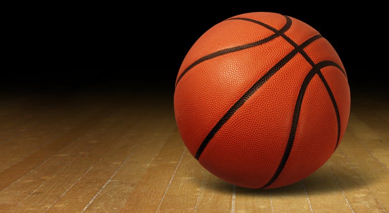 A basketball on a wooden floor