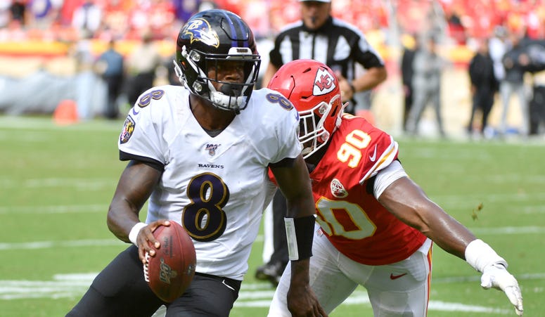 Denny Medley-USA TODAY Sports Sep 22, 2019; Kansas City, MO, USA; Baltimore Ravens quarterback Lamar Jackson (8) runs in for a touchdown as Kansas City Chiefs defensive end Emmanuel Ogbah (90) attempts the tackle during the second half at Arrowhead Stadium. Mandatory Credit: Denny Med