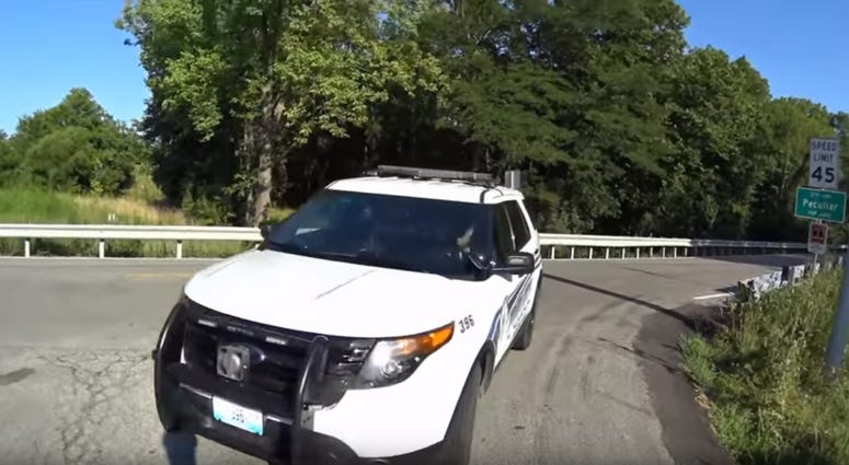 A screenshot of the video from Joe Fasanello as the Peculiar Police SUV turns, moments before the officer crashes into Fasanello