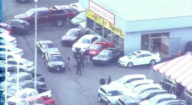 helicopter view of car dealership in Independence, MO after shooting