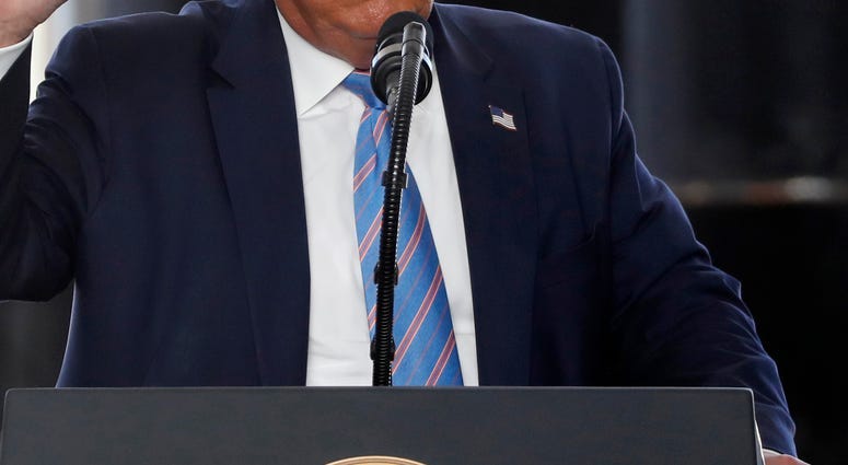 President trump speaks at a podium