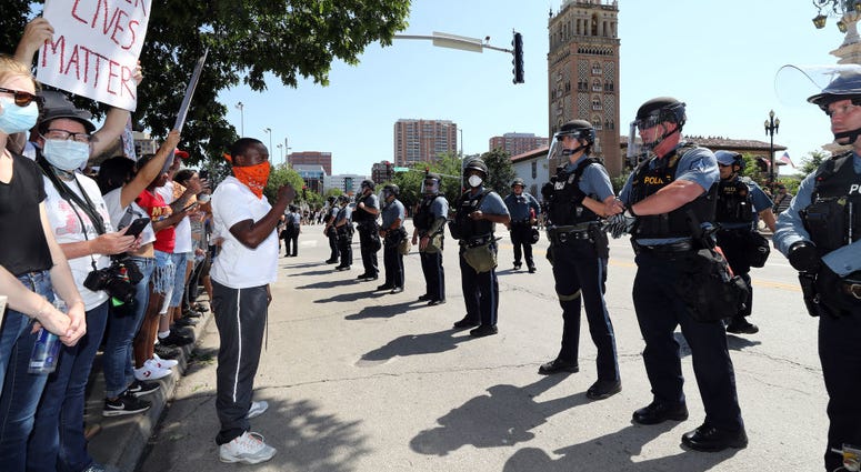 Demonstrators and police face each other during a protest at the Country Club Plaza on May 31, 2020 in Kansas City, Missouri.