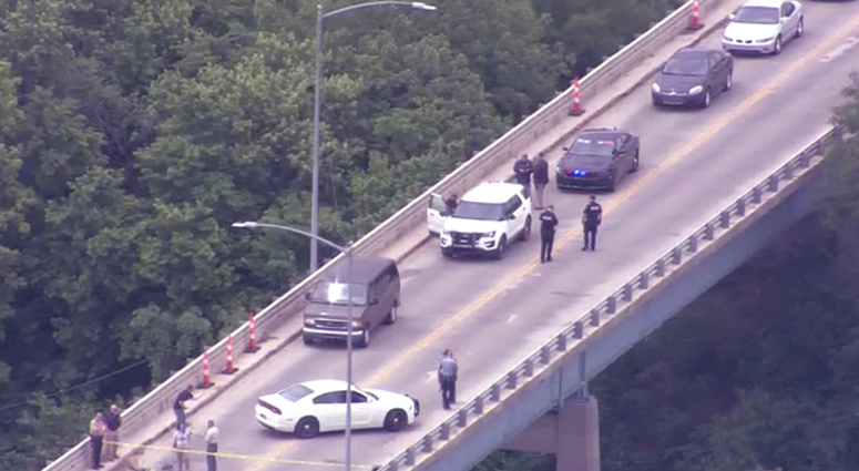 A helicopter view of a bridge in Leavenworth, KS where a gunman was stopped by an Army soldier by running over him.