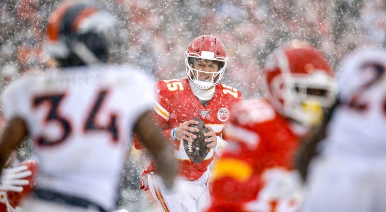 KC Chiefs quarterback Patrick Mahomes at Arrowhead in the snow during a game against the NE Patriots