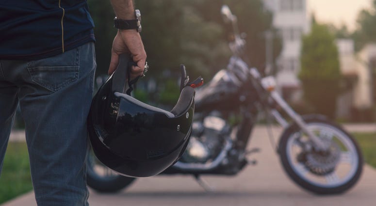 motorcycle rider with helmet