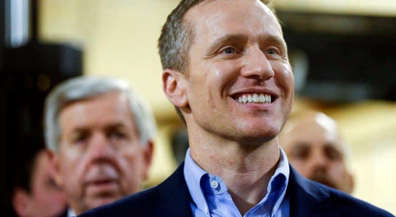 Gov Eric Greitens smiles during an event