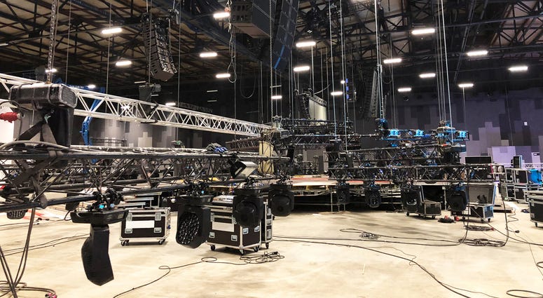nstallation of professional sound, light, video and stage equipment for a concert. Lifting of line array speakers.