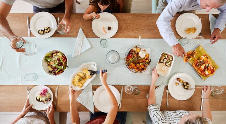 People sharing a meal around a dinner table