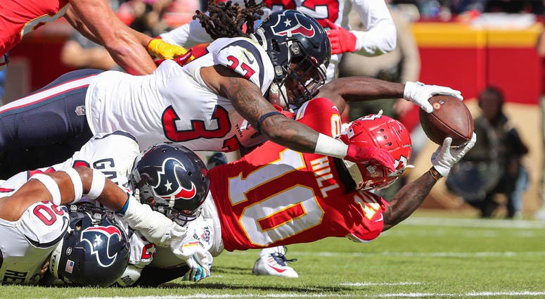 Oct 13, 2019; Kansas City, MO, USA; Kansas City Chiefs wide receiver Tyreek Hill (10) catches a pass for a touchdown against Houston Texans cornerback Phillip Gaines (29) and strong safety Justin Reid (20) and strong safety Jahleel Addae (37) during the f Oct 13, 2019; Kansas City, MO, USA; Kansas City Chiefs wide receiver Tyreek Hill (10) catches a pass for a touchdown against Houston Texans cornerback Phillip Gaines (29) and strong safety Justin Reid (20) and strong safety Jahleel Addae (37) during the f