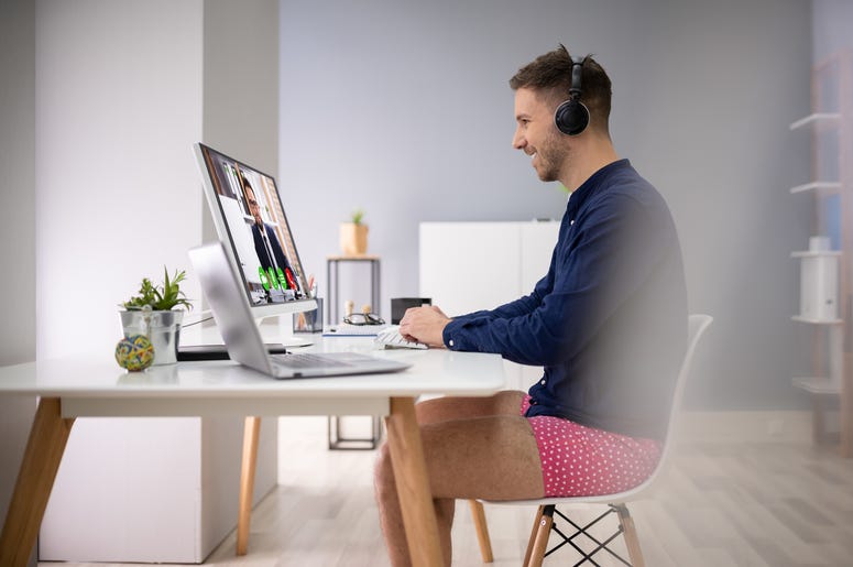 Businessman Attending Video Conference On Computer