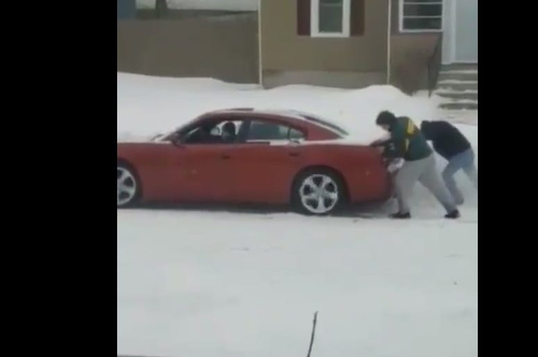 couple stuck in snow couple stuck in snow