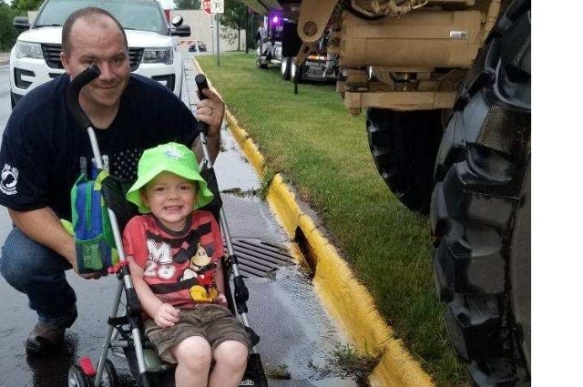 John Deere tractor toddler drives tractor to county fair